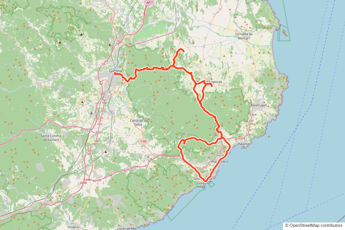 Map of the Day 2 route: from Girona across the Empordà to Sant Feliu de Guíxols on the coast and back over Els Àngels