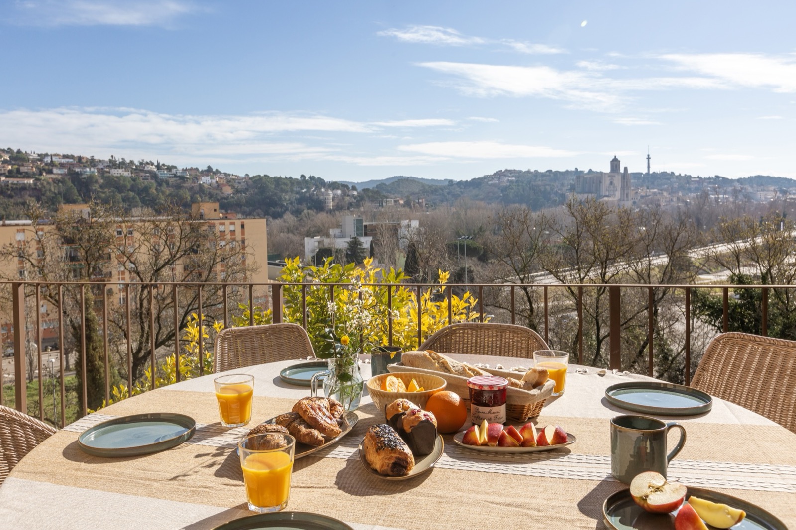 Breakfast on Can Martinoy's terrace with Girona's cathedral on the horizon
