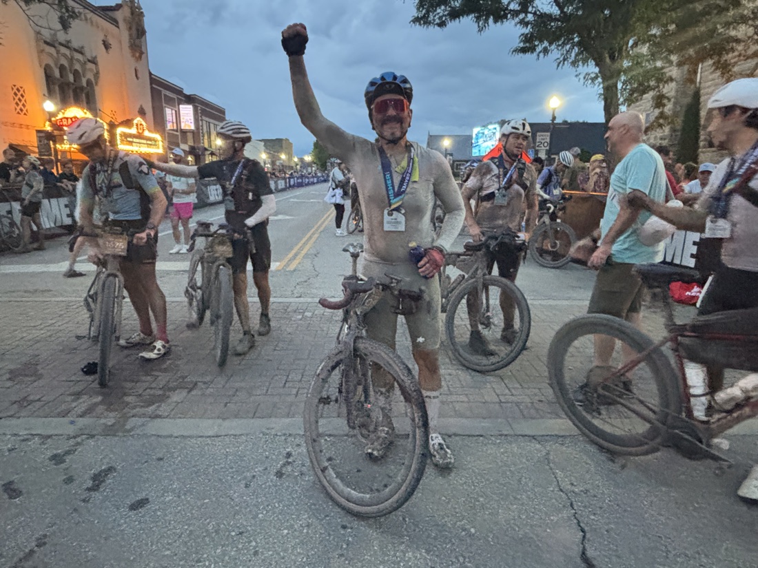 John Dendiuk celebrating at the UNBOUND Gravel finish